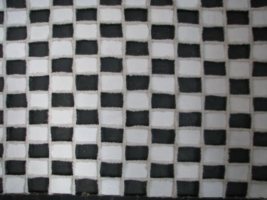 Obraz czarno białej szachownicy pod tytułem "Symetria"