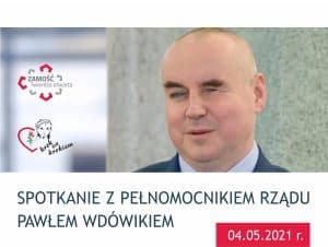 Zdjęcie Pawła Wdówika. Poniżej belka z tekstem: Spotkanie z Pełnomocnikiem Rządu Pawłem Wdówikiem 04.05.2021