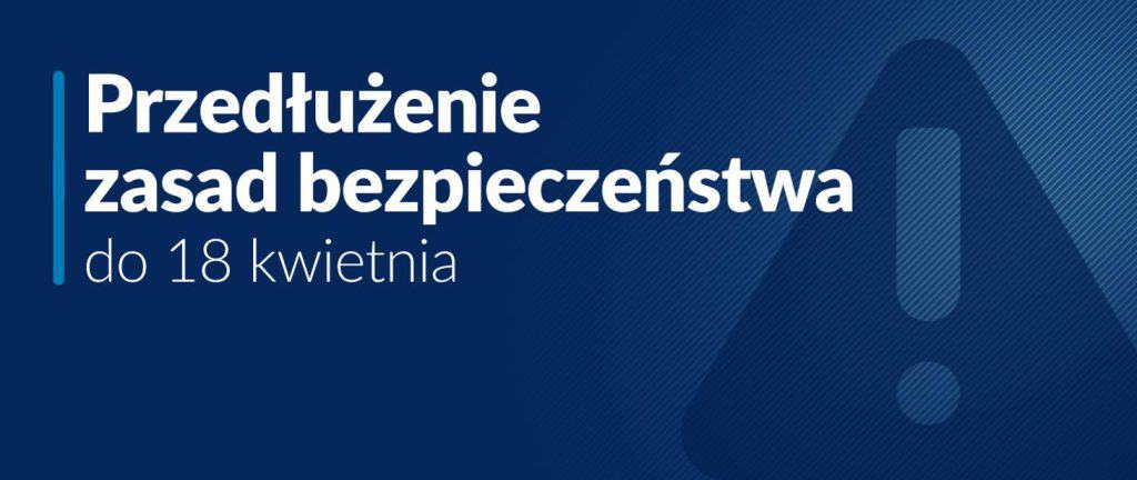 Granatowe tło i biały napis: przedłużenie zasad bezpieczeństwa do 18 kwietnia. Na tle znak: trójkąt z wykrzyknikiem w środku