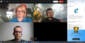 Dwóch mężczyzn i kobieta na kamerach w zoom.