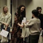 Od lewej stoją: Pani Natalia Dudek (laureatka), laureatka Pani Katarzyna Kubiak podczas odbioru nagrody rzeczowej od Pani Moniki Rozwałki oraz Pani Iwona Gieruszczak