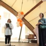 Na scenie od lewej: Pani Alicja Jankiewicz – Prezes Zarządu Lubelskiego Forum Organizacji Osób Niepełnosprawnych – Sejmik Wojewódzki; Pani Anna Bieganowska-Skóra – Sekretarz Zarządu Lubelskiego Forum Organizacji Osób Niepełnosprawnych – Sejmik Wojewódzki