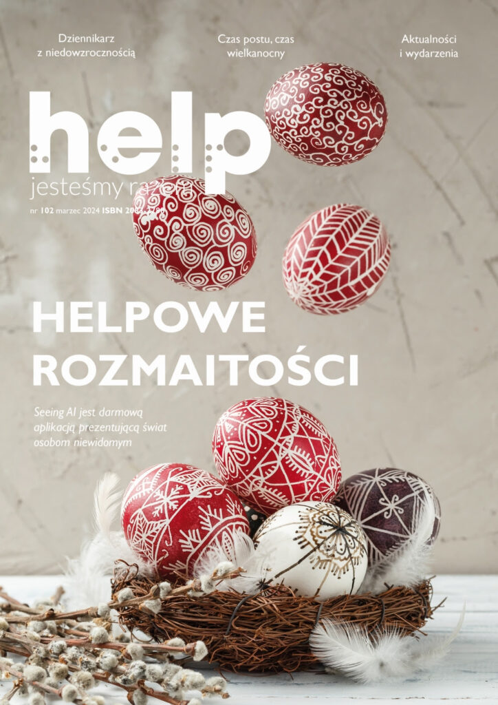 Grafika 102. numeru miesięcznika Help. Widnieją na niej kolorowe pisanki ułożone w małym koszyczku. Z góry wpadają do niego kolejne umalowane jajka. Obok leżą białe piórka i wiosenne bazie.