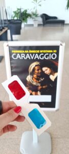 Plakat wystawy Caravaggio 3D na Targach Lublin oraz okulary 3D