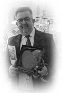 Jarosław Chabros (25.04.1969 - 25.06.2026); odbiera nagrodę podczas obchodów Międzynarodowego Dnia Wolontariatu, grudzień 2024
